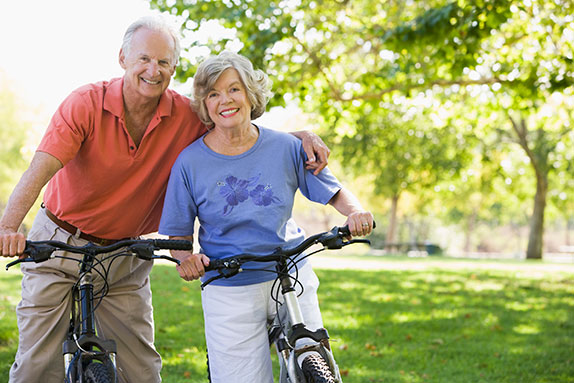 Photo of a man and woman on bicycles. Link to Life Stage Gift Planner Ages 45-65 Situations.